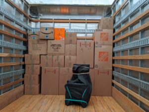 The fully-packed boxes start to be loaded into a Broad Street Movers truck as another local move in the Philly area begins