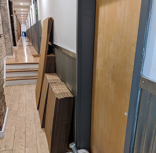 Boxes lining the hallway of a Philadelphia office moving job expertly handled by Broad Street Movers.